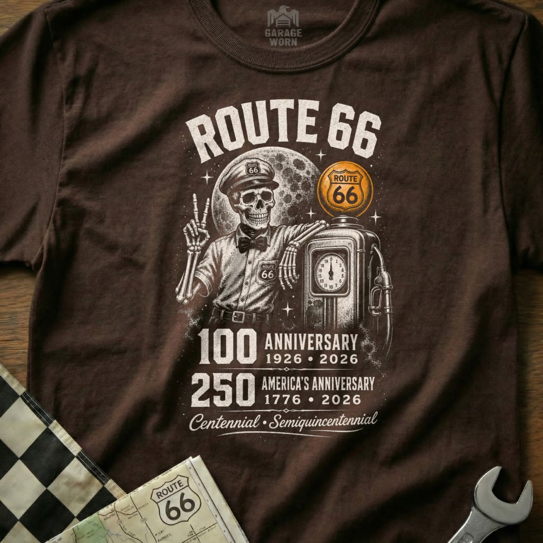 Brown t-shirt with Route 66 skeleton leaning on a gas pump, celebrating anniversaries.