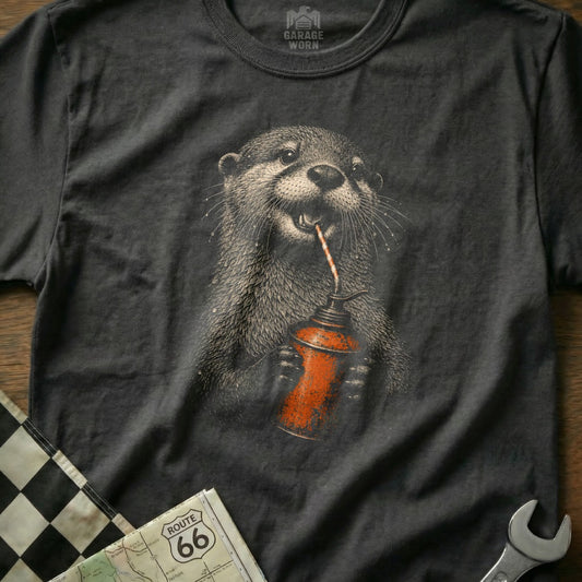 Dark grey t-shirt graphic of a cartoon otter drinking from an oil can.