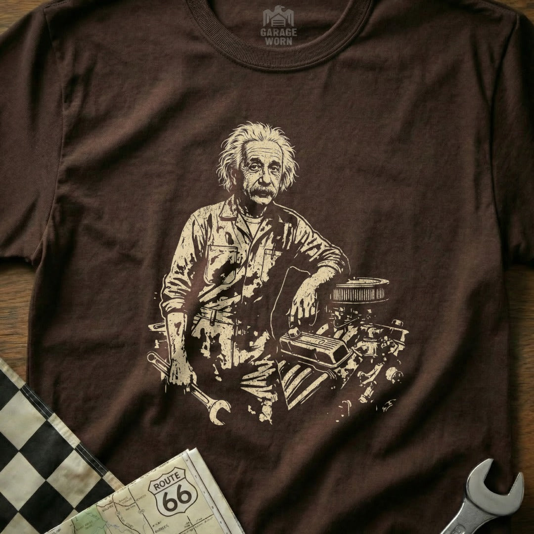 Albert Einstein leaning on an engine, holding a wrench.