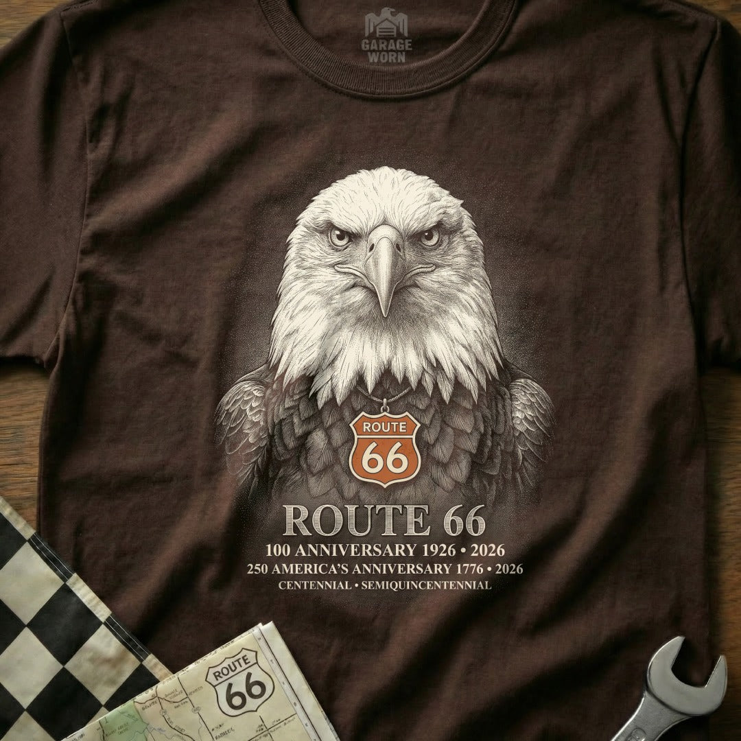 Brown t-shirt with realistic eagle graphic wearing a Route 66 necklace and anniversary text.
