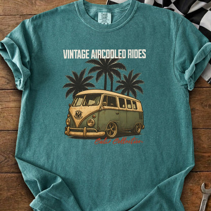 Teal t-shirt with vintage bus, palm trees, and "Vintage Aircooled Rides" text.