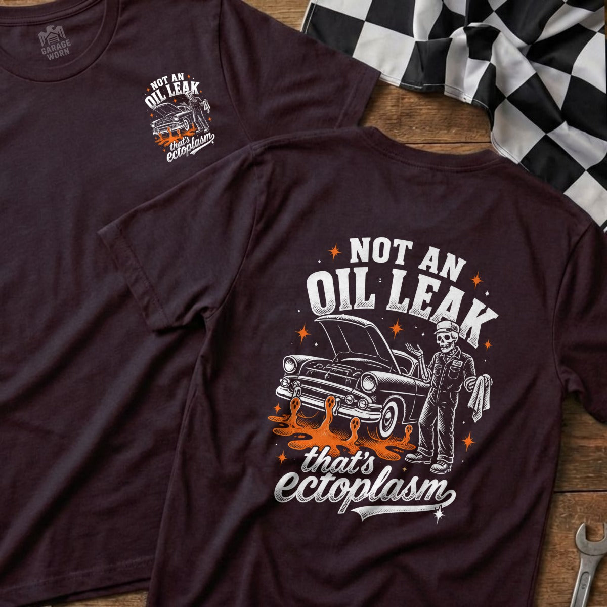 Dark t-shirt with "NOT AN OIL LEAK that's ectoplasm" text and skeleton mechanic.