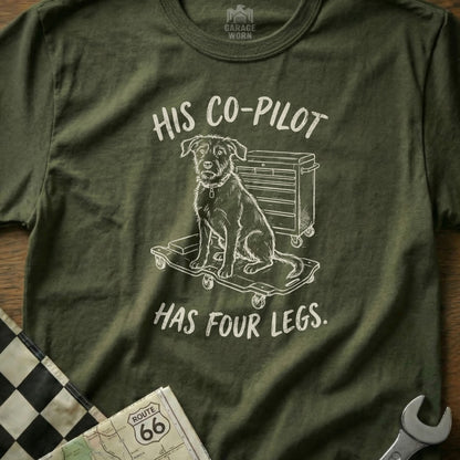 Green t-shirt with dog on a tool cart graphic and text "HIS CO-PILOT HAS FOUR LEGS."