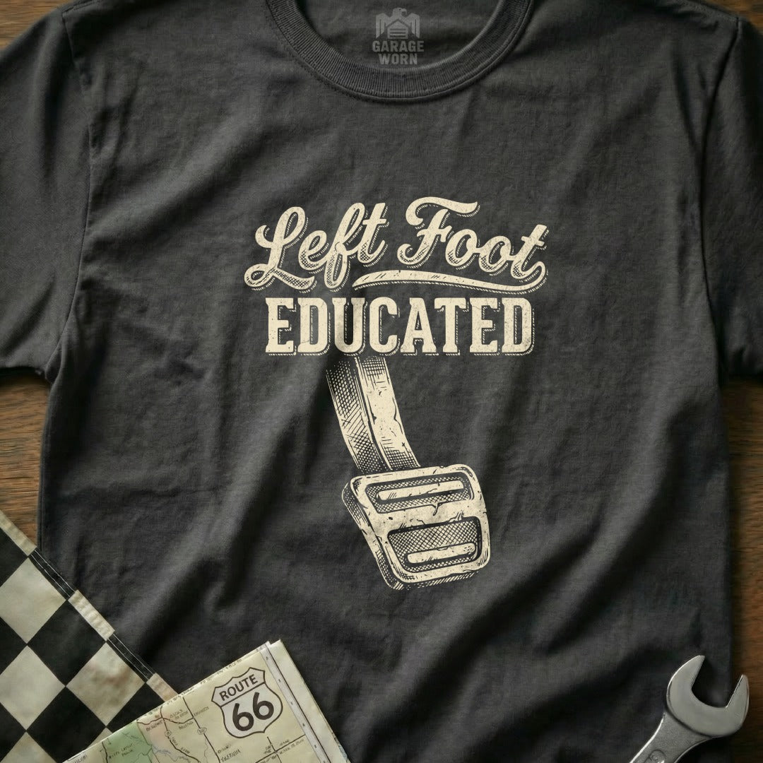 Dark t-shirt with "Left Foot Educated" text and a gas pedal illustration.