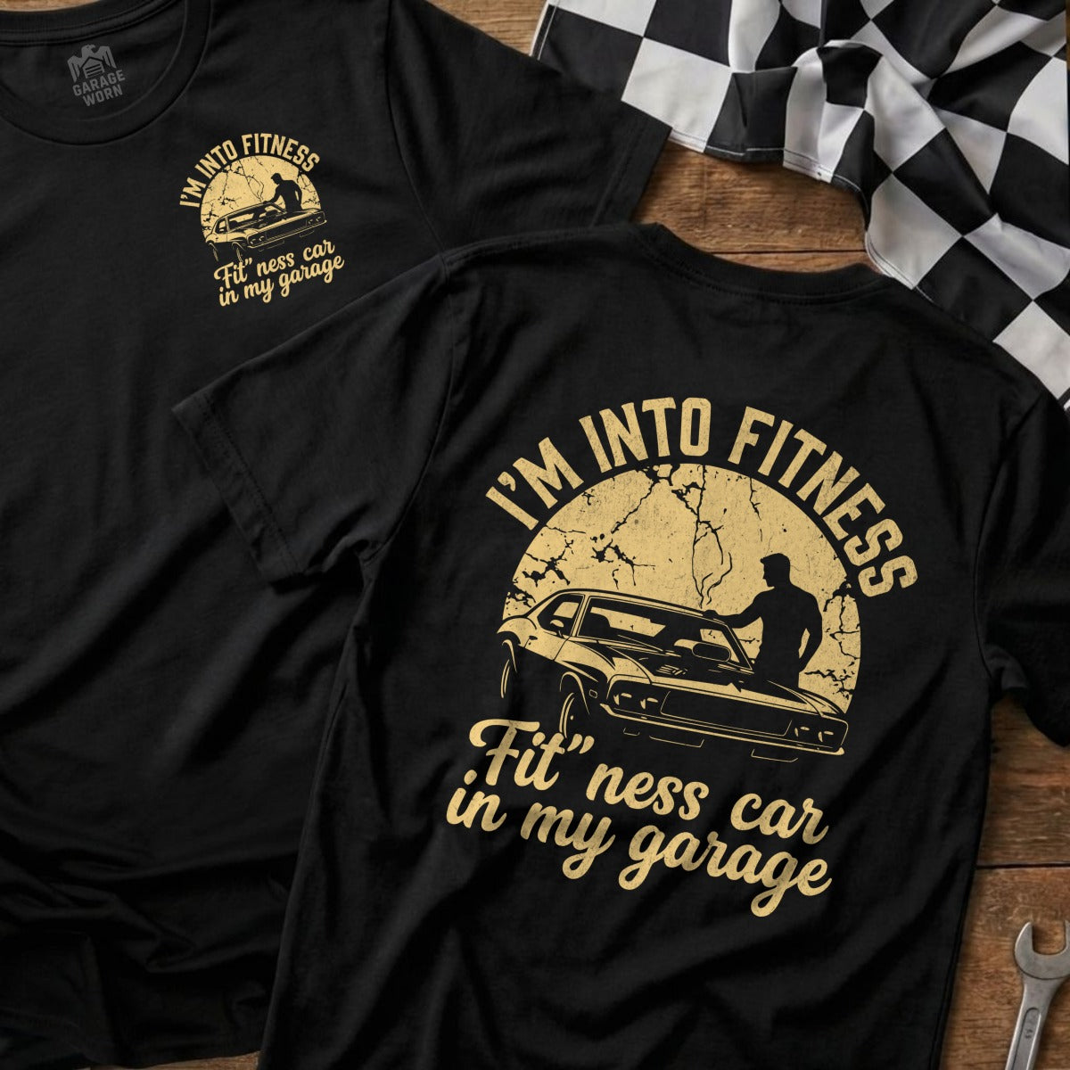 Black t-shirt with "I'M INTO FITNESS Fit'ness car in my garage" and car graphic.
