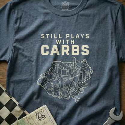 Navy t-shirt with a white graphic of a carburetor and "STILL PLAYS WITH CARBS".