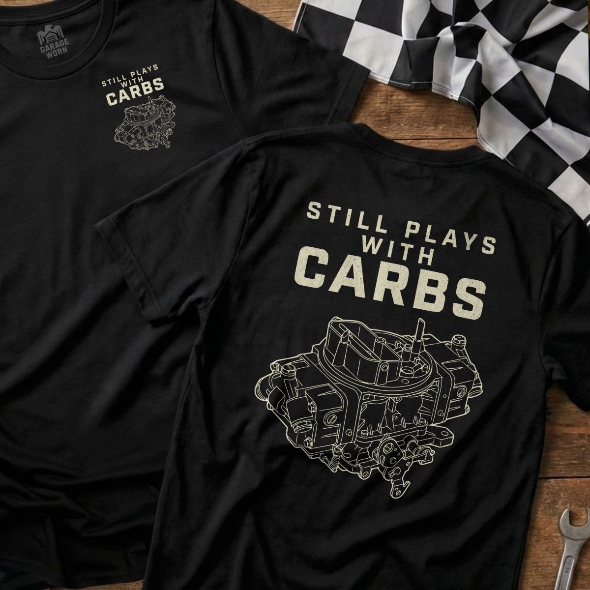 Black t-shirt with "Still Plays with Carbs" and carburetor graphic.