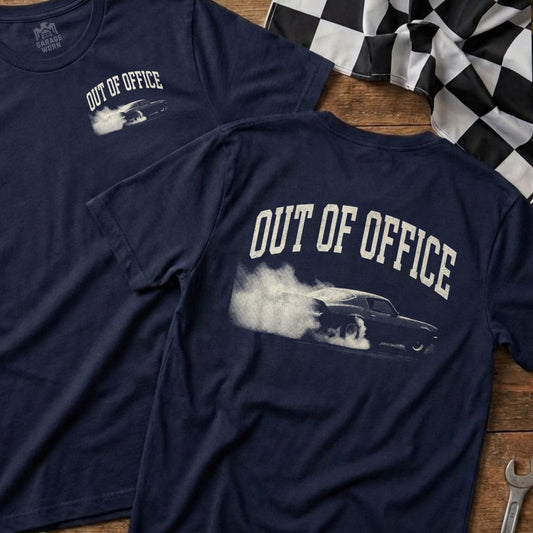 Dark blue t-shirt with white "OUT OF OFFICE" text and smoking car graphic.