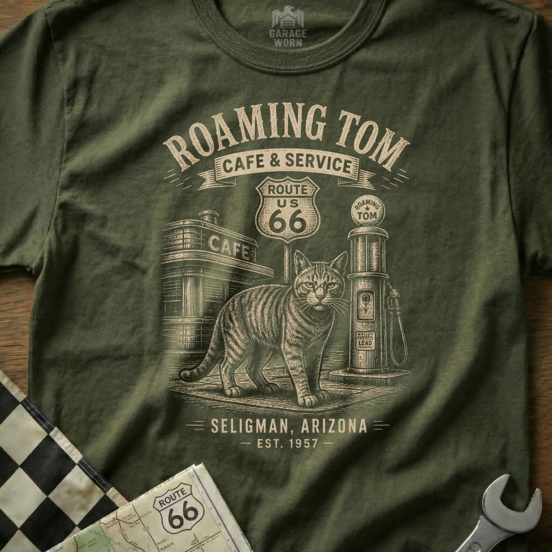 T-shirt graphic with a cat, Route 66 sign, cafe, and gas pump.