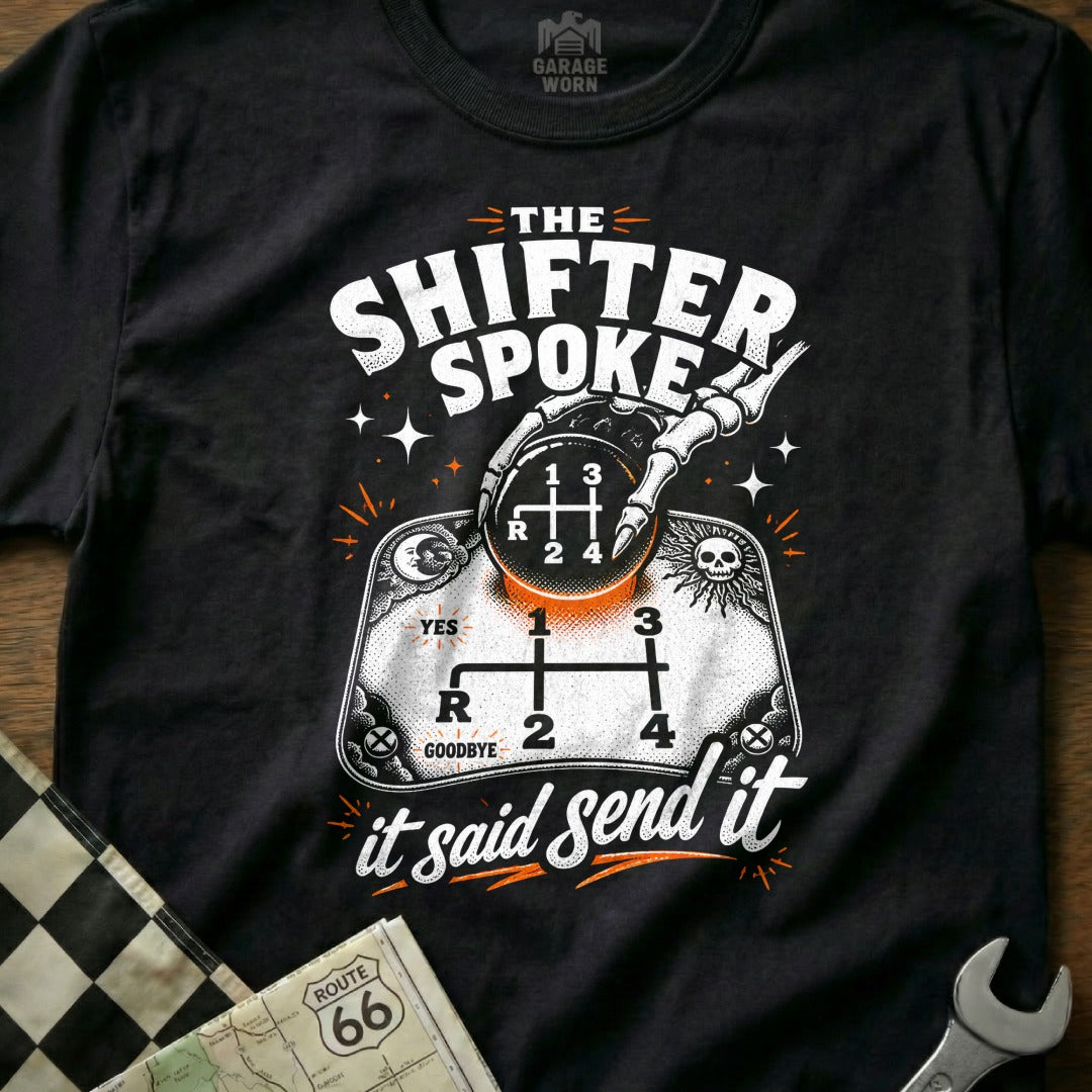 Black t-shirt with skeleton hand on gear shift, "The Shifter Spoke it Said Send It".