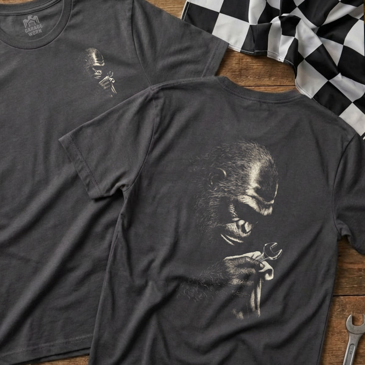 Dark grey t-shirt with a detailed illustration of a gorilla holding a wrench.