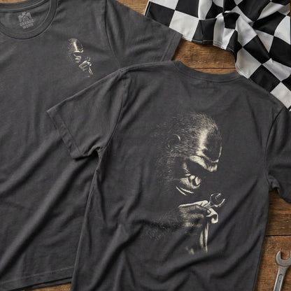 Dark grey t-shirt with a detailed illustration of a gorilla holding a wrench.