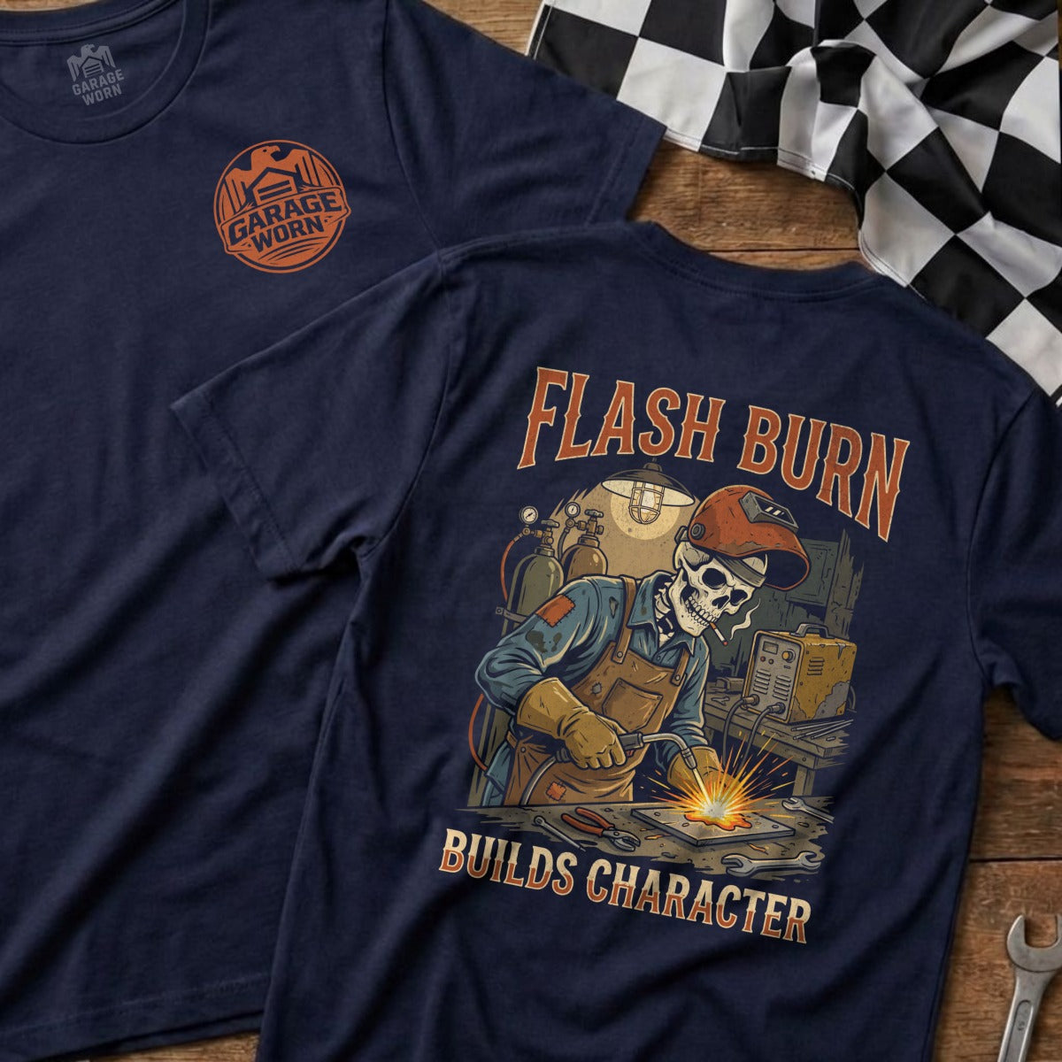 Navy t-shirt with "Flash Burn Builds Character" skeleton welding graphic.