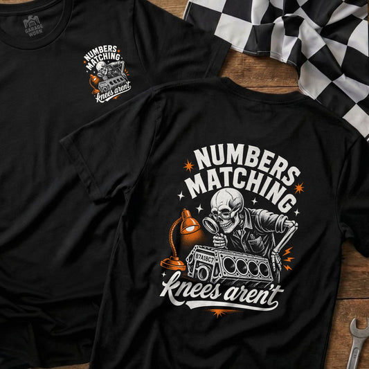 Black t-shirt with skeleton inspecting engine block: "Numbers Matching Knees Aren't".