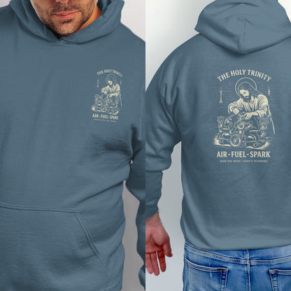 Blue hoodie with Jesus working on an engine, text: The Holy Trinity, Air-Fuel-Spark.