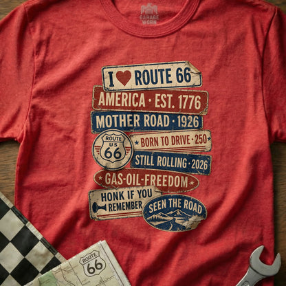 Red t-shirt with Route 66 themed signs including "I LOVE ROUTE 66" and "STILL ROLLING 2026".