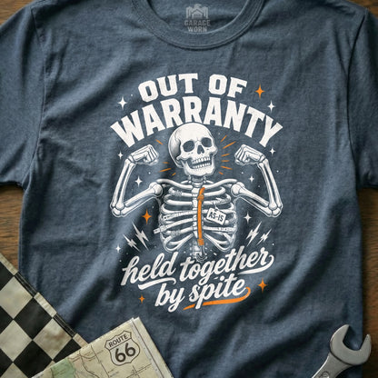 T-shirt graphic: skeleton, "Out of Warranty," "AS-IS," "Held Together By Spite."