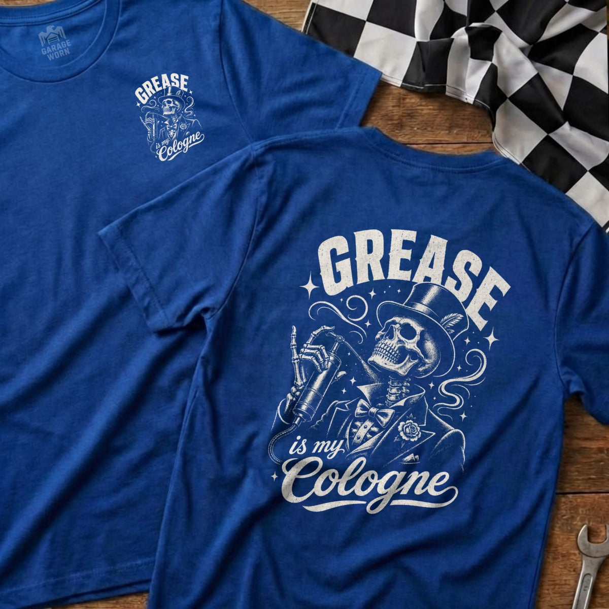Two blue t-shirts, one with a chest graphic, and one with a back graphic of a skeleton spraying cologne.