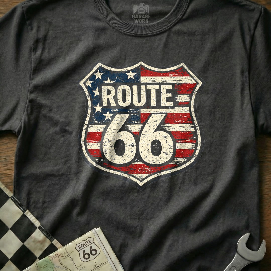 Route 66 shield logo with distressed American flag pattern on a dark t-shirt.