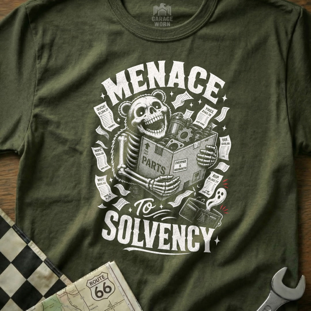 Skeleton holding parts box on green shirt with text "Menace To Solvency" and receipts.