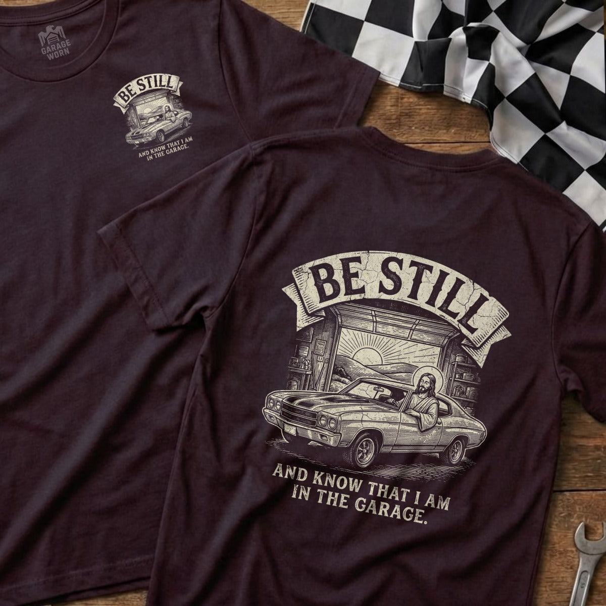 Maroon t-shirt with "BE STILL AND KNOW THAT I AM IN THE GARAGE" and a car graphic.