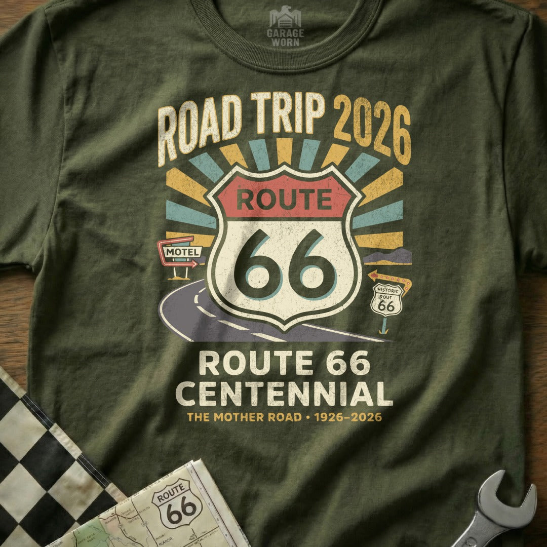 Olive green t-shirt celebrating Route 66 Centennial with "Road Trip 2026" and "The Mother Road".