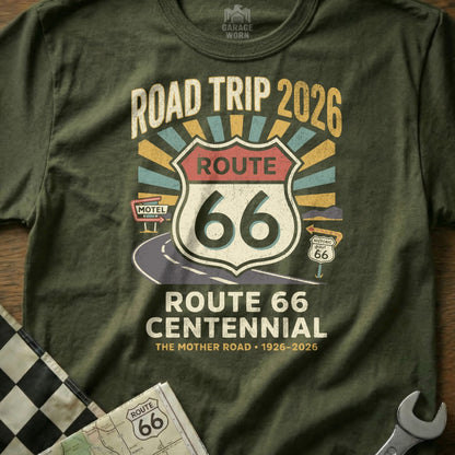 Olive green t-shirt celebrating Route 66 Centennial with "Road Trip 2026" and "The Mother Road".
