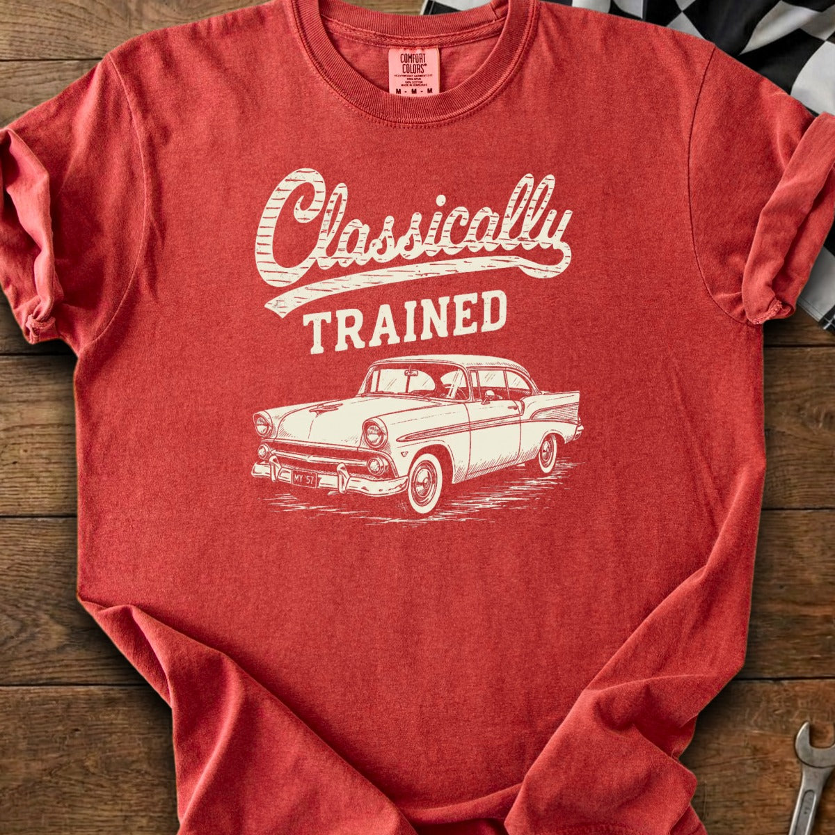Red t-shirt with "Classically TRAINED" and vintage car graphic.