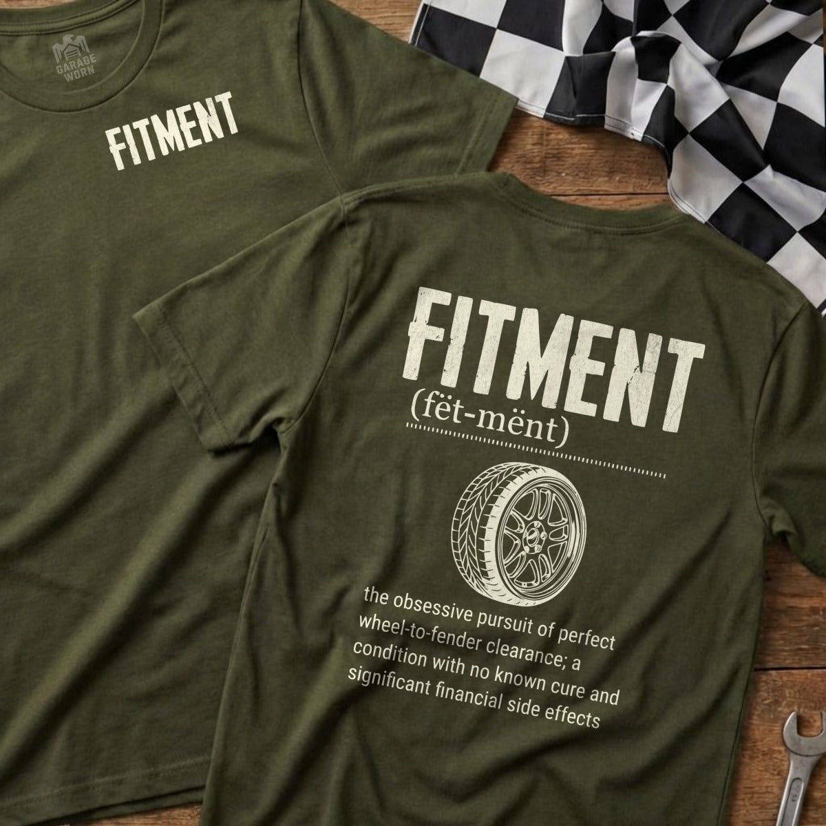 FITMENT t-shirt with dictionary definition and racing flag on wooden surface.