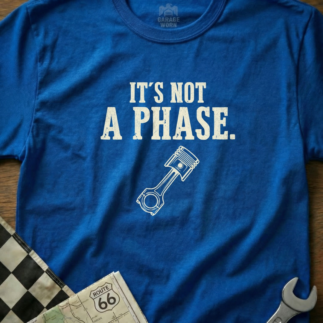 Blue t-shirt with "It's NOT A PHASE" and piston graphic.