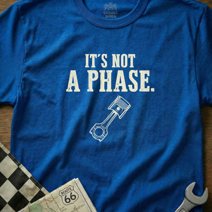 Blue t-shirt with "It's NOT A PHASE" and piston graphic.