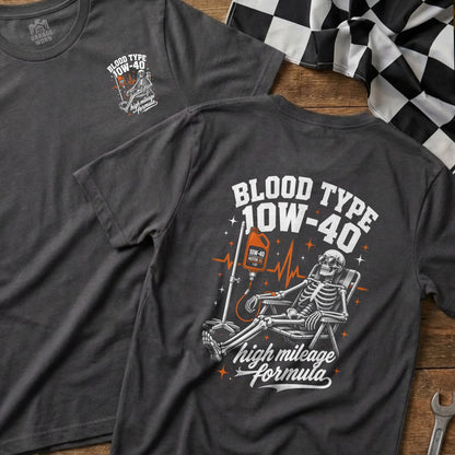 Dark grey t-shirt with "Blood Type 10W-40 High Mileage Formula" skeleton graphic.