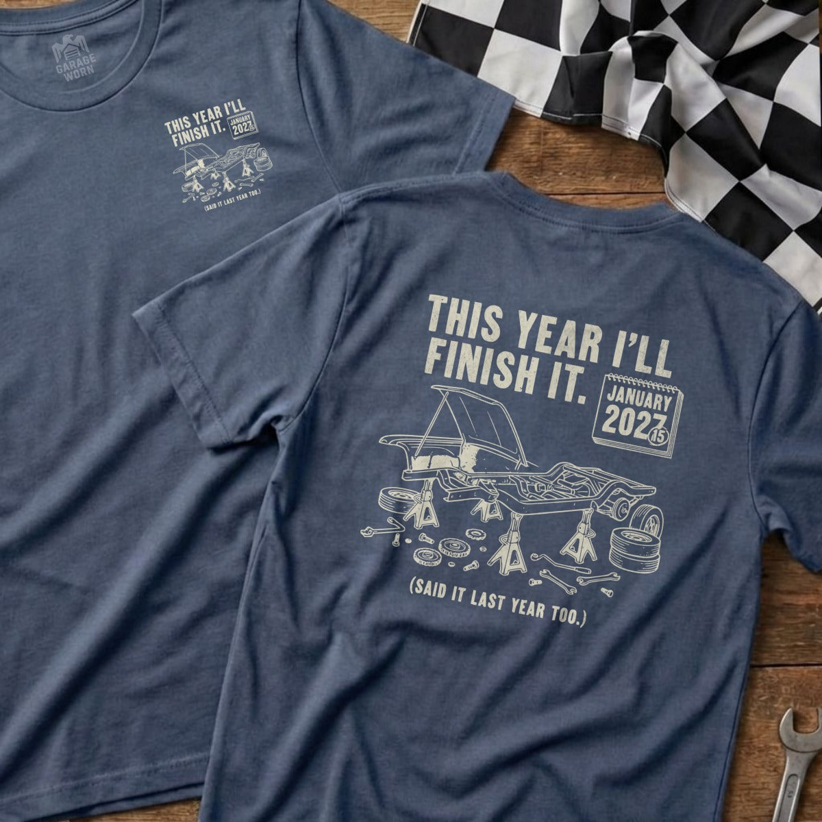 T-shirt with illustration of car on jack stands and text "This year I'll finish it."