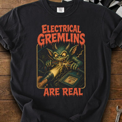 Black t-shirt with "ELECTRICAL GREMLINS ARE REAL" text and a green gremlin sparking wires.