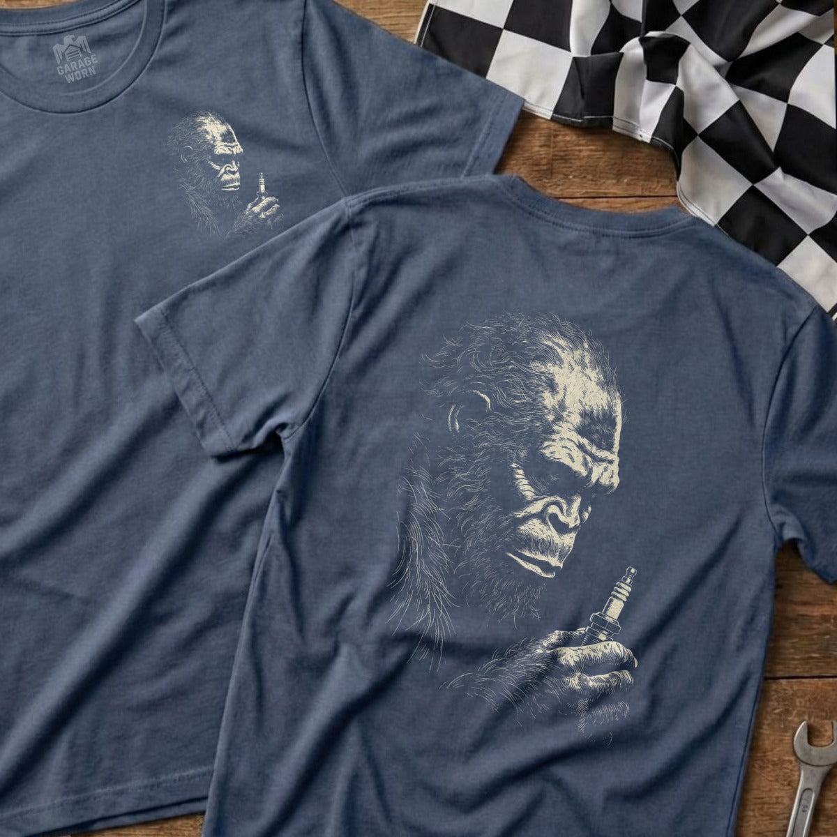 Dark blue t-shirt featuring a detailed sketch of a gorilla holding a spark plug.