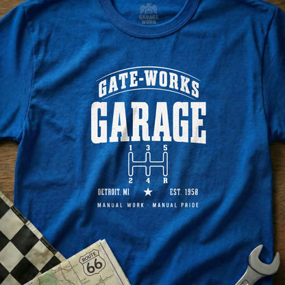 Blue t-shirt with "GATE-WORKS GARAGE" and a manual transmission graphic.