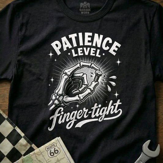Black t-shirt with skeleton hand tightening screw, text reads "PATIENCE LEVEL finger-tight."