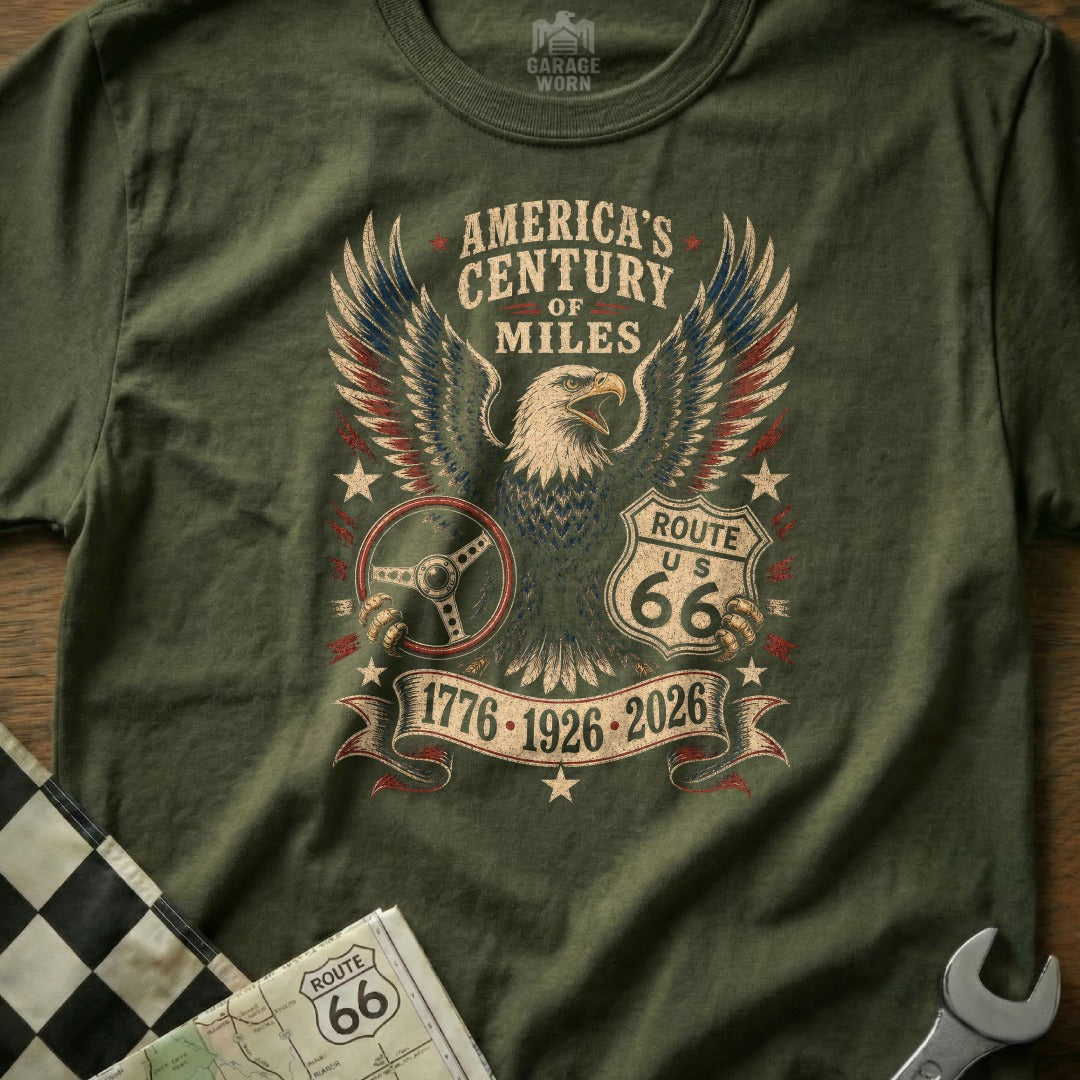 Olive green t-shirt with an eagle, steering wheel, and "America's Century of Miles Route US 66" text.