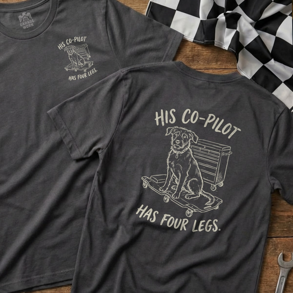 Dark grey t-shirt with illustration of dog on skateboard and text "His Co-Pilot Has Four Legs."