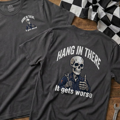 T-shirt with skeleton giving thumbs up and "Hang in there. It gets worse" text.