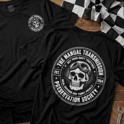 Black t-shirt with graphic of skull wearing goggles and text "Manual Transmission Preservation Society".