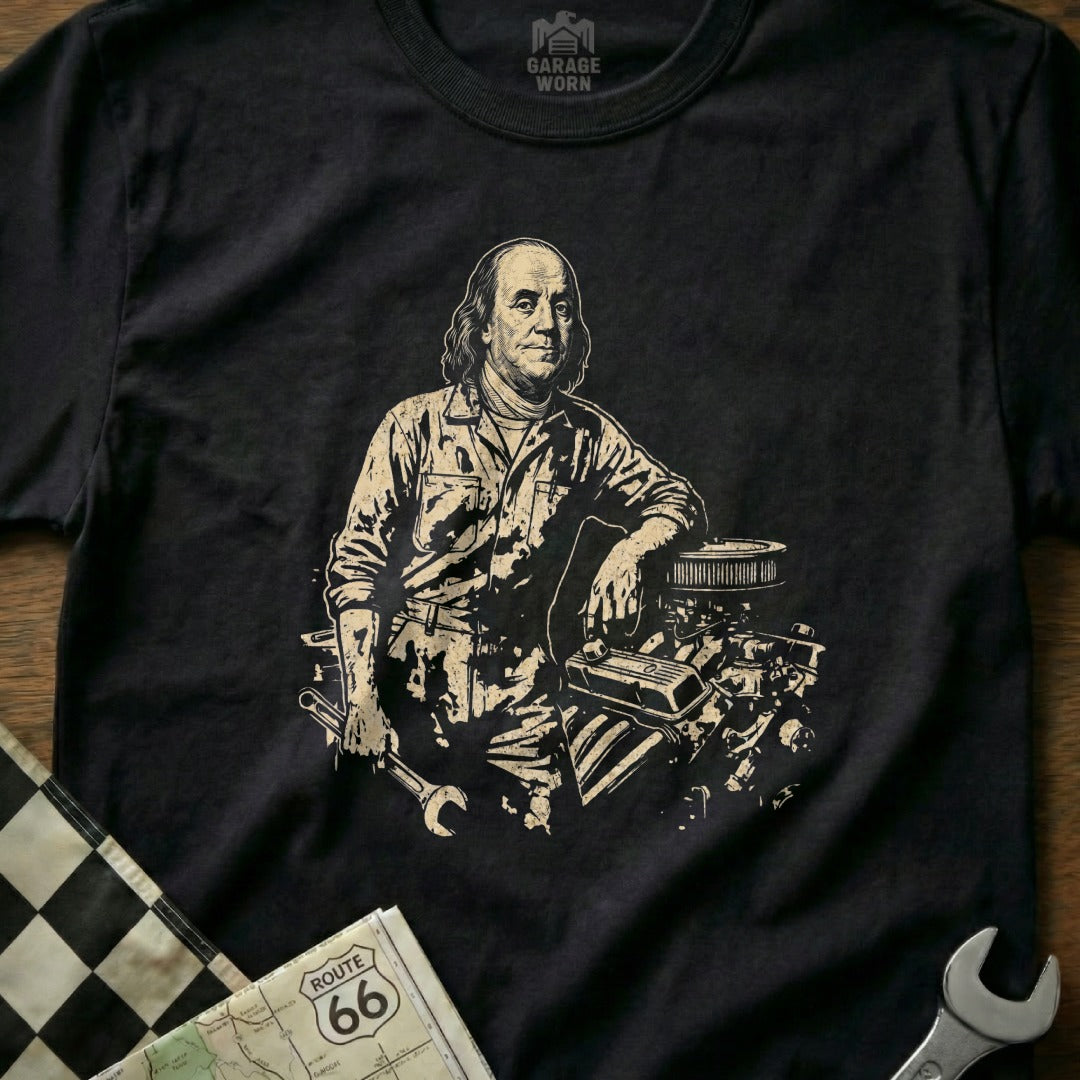 Benjamin Franklin in mechanic's clothes leaning on car engine, holding a wrench.