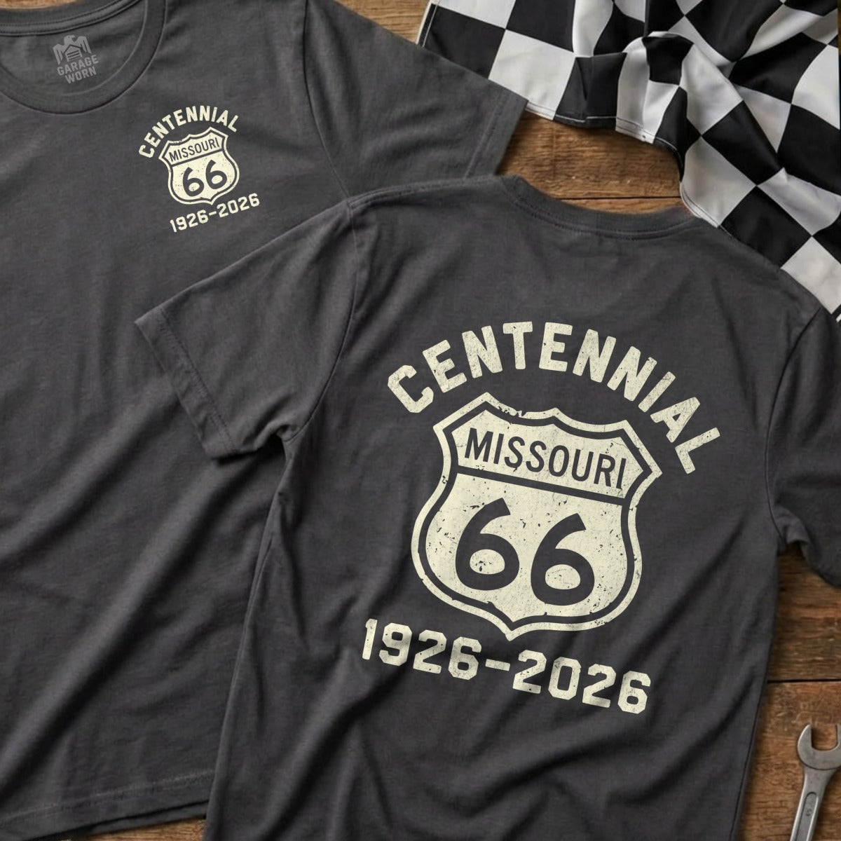Dark gray t-shirt with Route 66 logo and "Centennial Missouri 1926-2026" text.