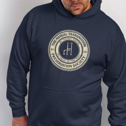 Navy hoodie with "The Manual Transmission Preservation Society" circular graphic.