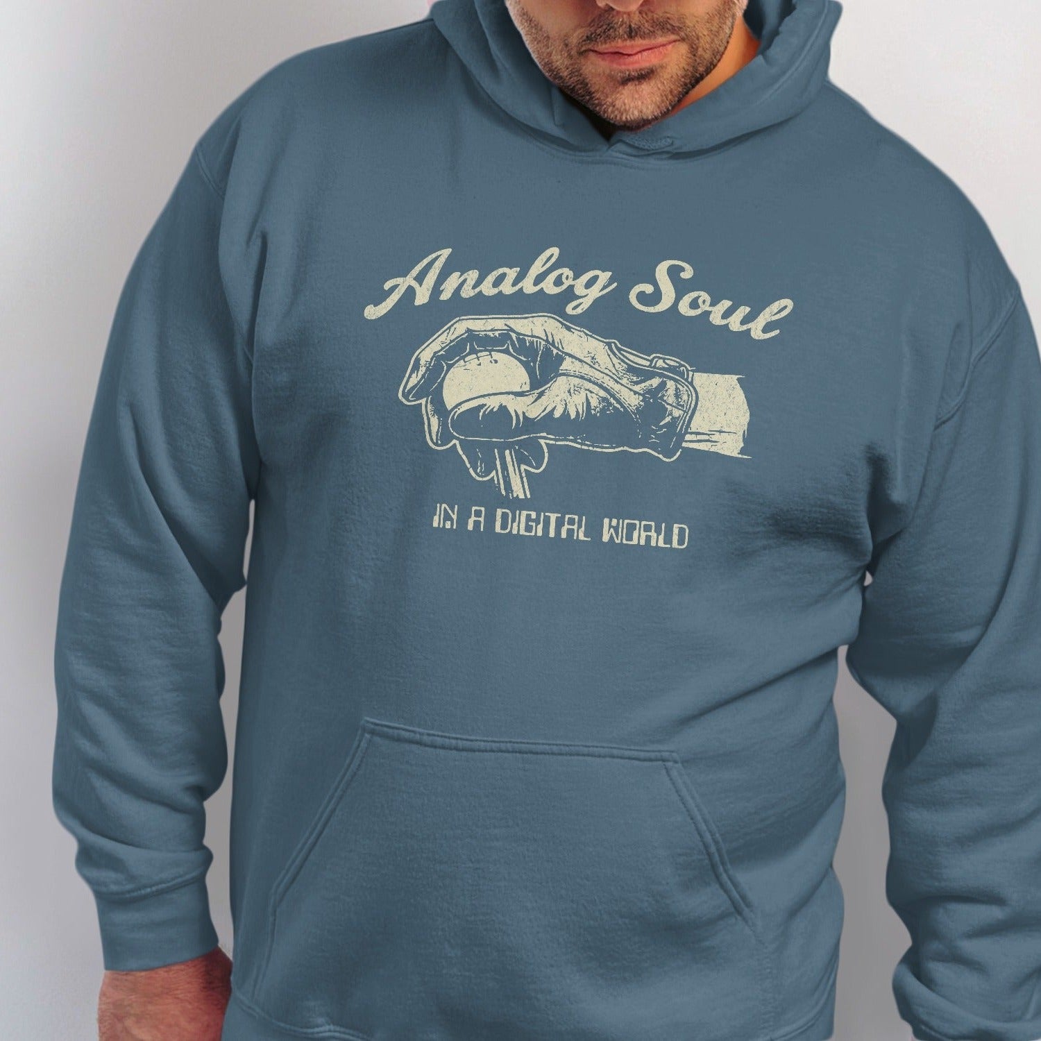 Blue hoodie with "Analog Soul in a Digital World" text and vintage baseball hand graphic.