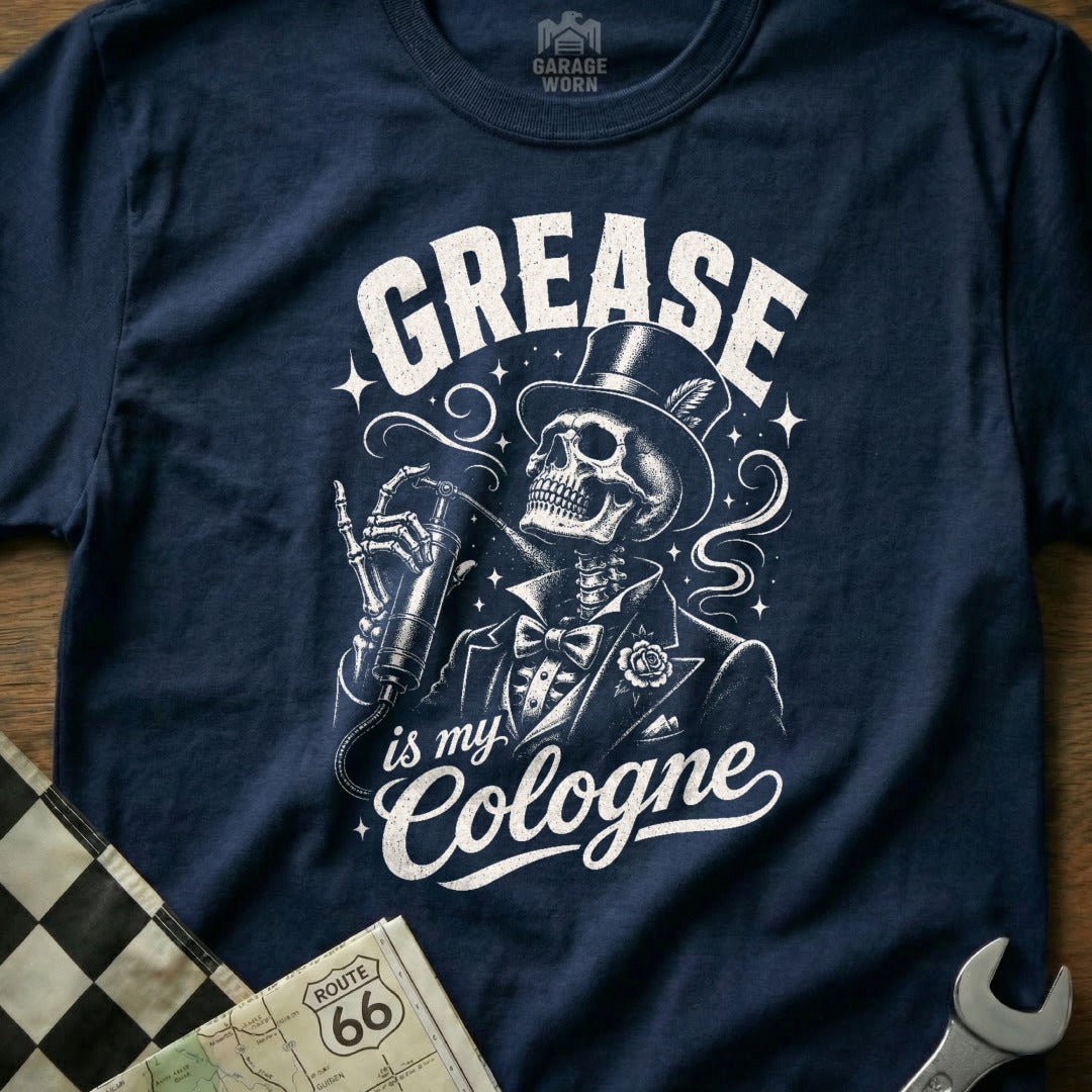 Navy t-shirt with skeleton in top hat holding grease gun, text "GREASE is my Cologne".