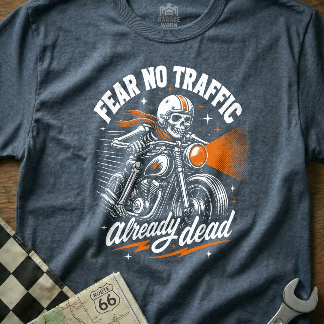 Skeleton biker with helmet and scarf rides motorcycle with text "FEAR NO TRAFFIC already dead".