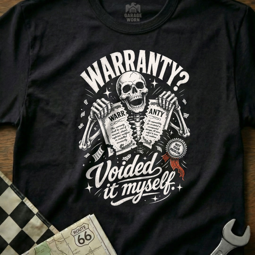 Black t-shirt with skeleton ripping warranty papers, text reads "WARRANTY? Voided it myself."