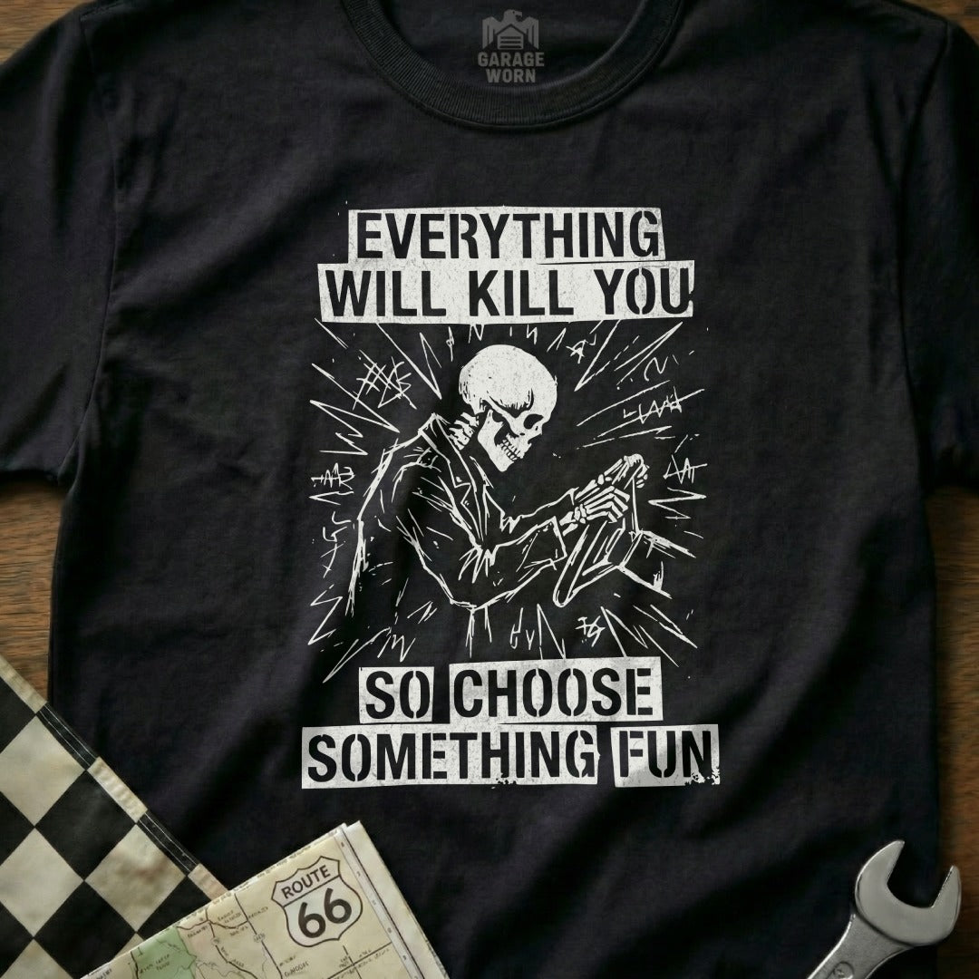 Black t-shirt with skeleton driving and text "Everything will kill you so choose something fun".