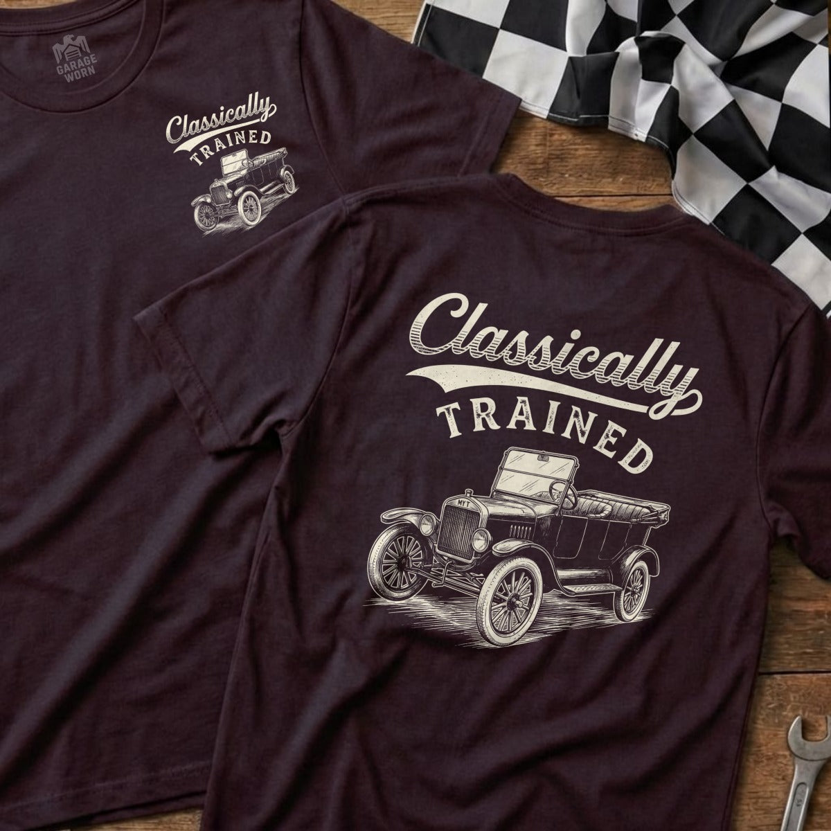 Two dark burgundy t-shirts featuring a vintage car graphic and text.
